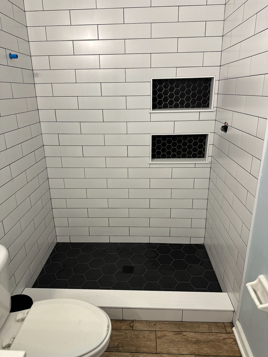 Schluter system black and white modern shower with double niche, St. Augustine FL