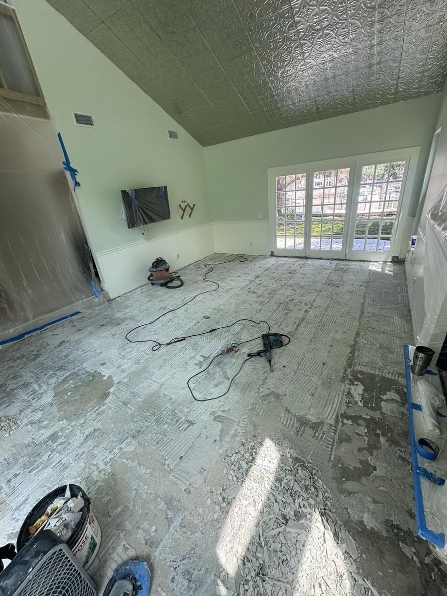 Floor tile and thinset removed down to the slab during a residential demolition, St. Augustine FL