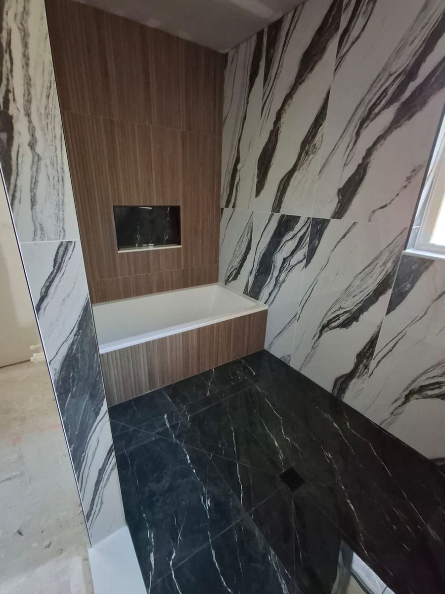 Combination Tub and Shower Remodel with Envelope-cut shower floor for large format tile, St. Augustine FL