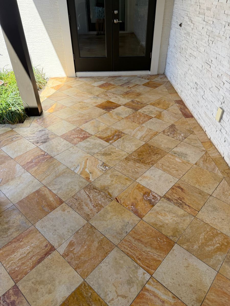 Scabos Travertine diagonal tile floor with border in Courtyard, Anastasia Island St. Augustine FL