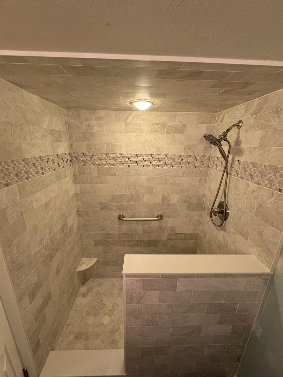 Shower Remodel with luxury marble throughout, accent band feature, St. Augustine FL
