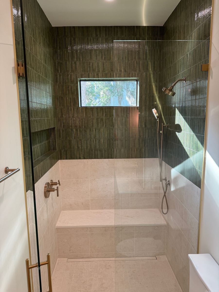 Two-tone shower with zero-entry Schluter Kerdi-line drain system, satin gold trim, Fernandina Beach FL