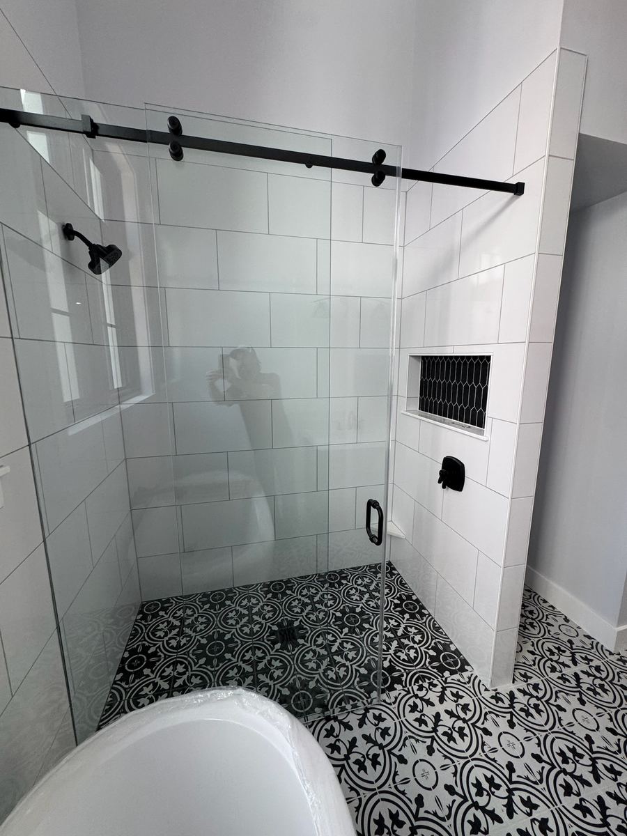 Zero-entry two-tone master shower with frameless barn door enclosure, Anastasia Island St. Augustine FL